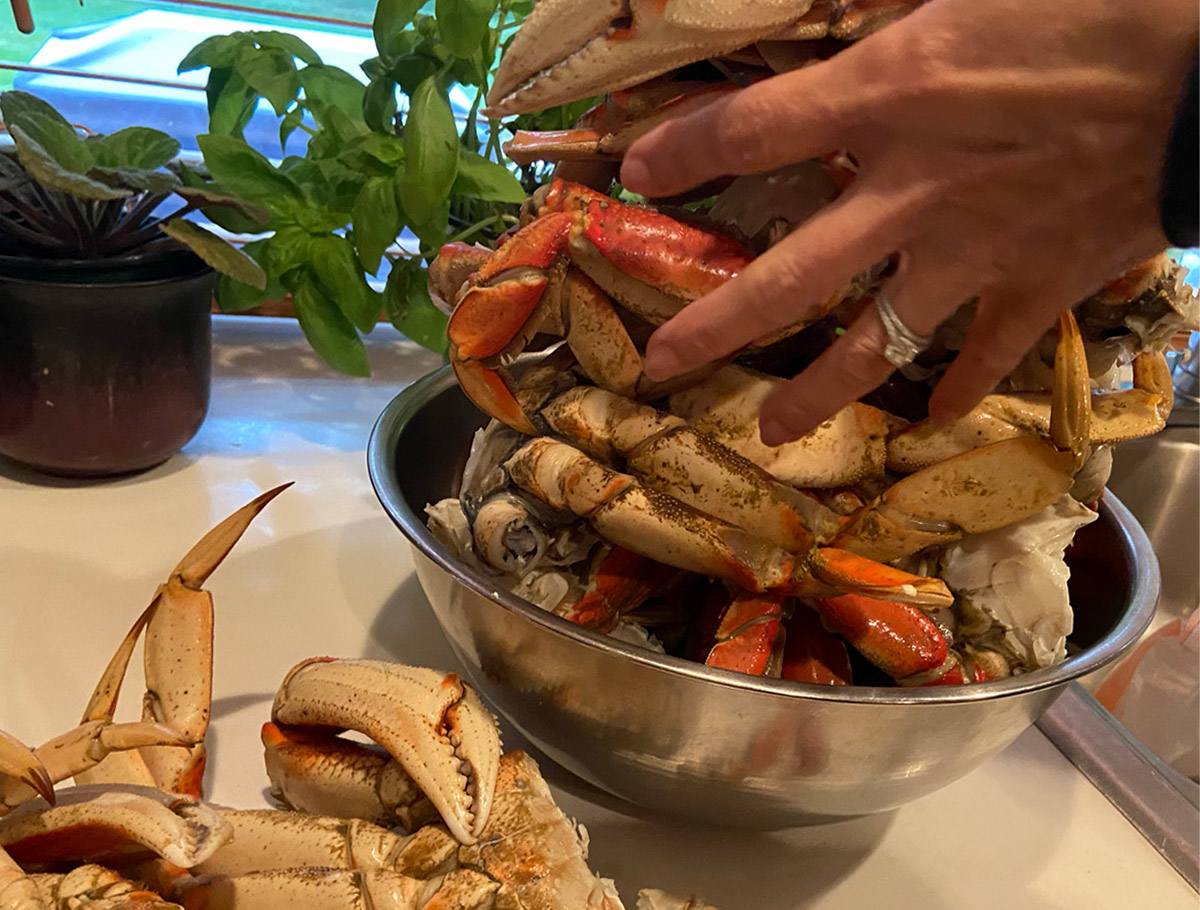 Fresh crab dining on the beach is part of Salish Center's Crab Feast Events